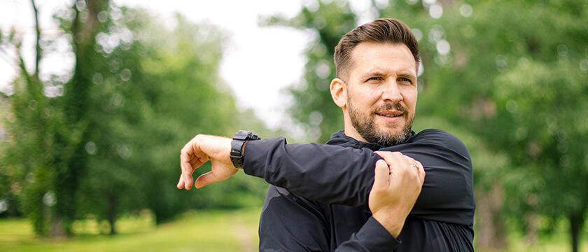 Athletic Man Stretching his Shoulder