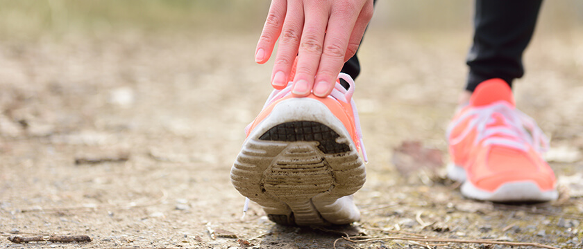 Stretching Calf (Close Up of Toe in Running Shoe)