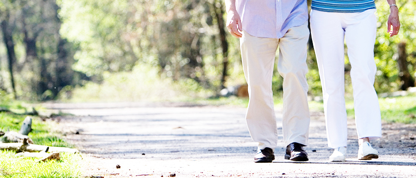 Couple's Feet Walking in Park