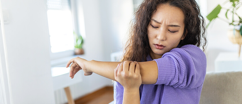 Woman Holding Her Elbow