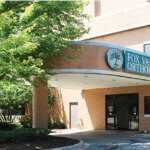 Elgin - Lin Lor Building Entrance: Awning with Fox Valley Orthopedic Logo and Lettering