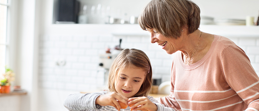 Grandmother Cooking with Granddaughter