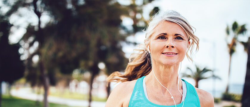 Woman Jogging with Earbuds