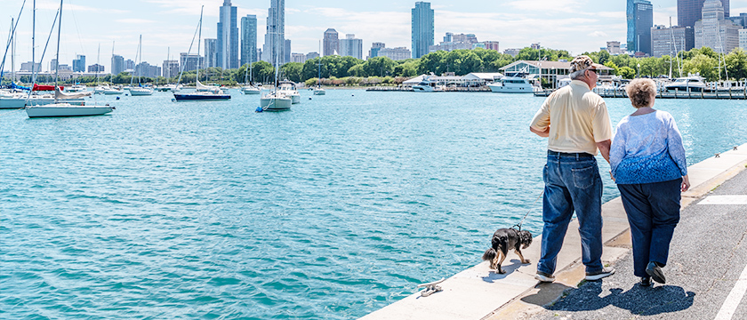 Couple Walking Along Lake Shore
