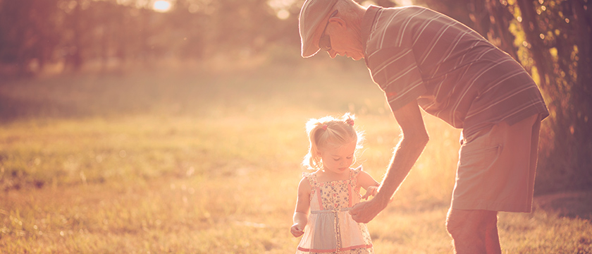 Man Showing Granddaughter Something Outside