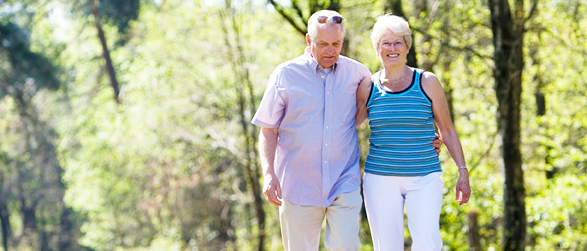 Older Couple Walking Outside Together