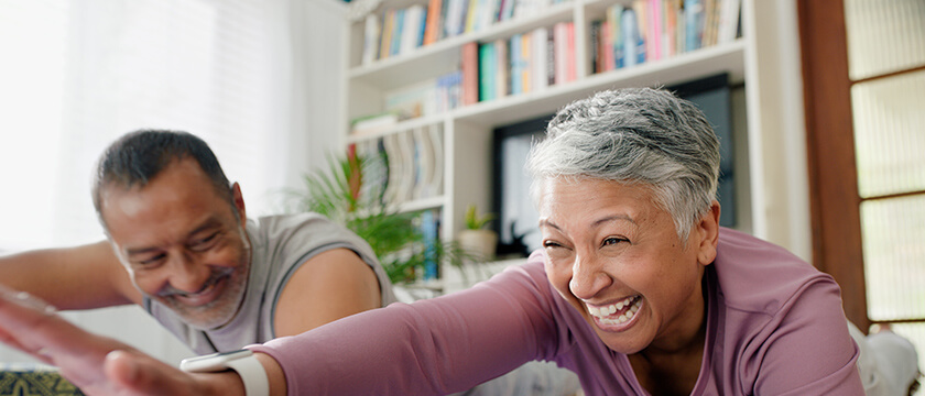 Couple Stretching in Living Room