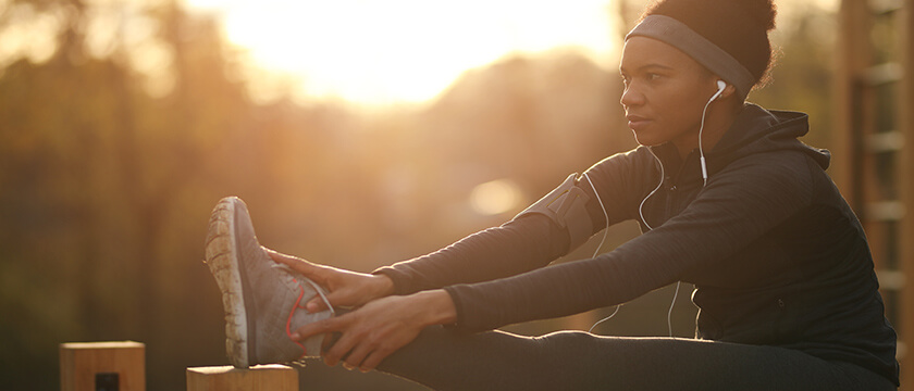 Woman Runner Stretching
