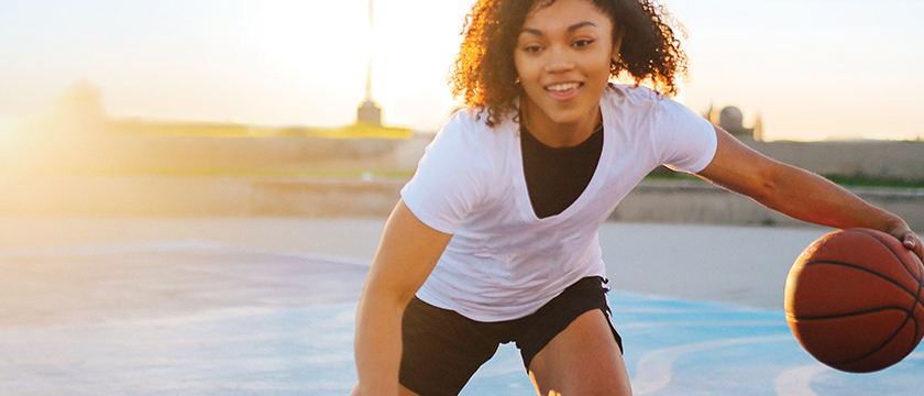 Teen Girl Playing Basketball
