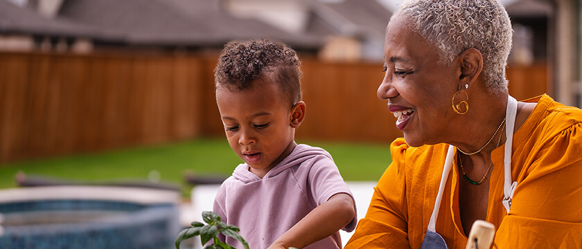 Woman Gardening with Child