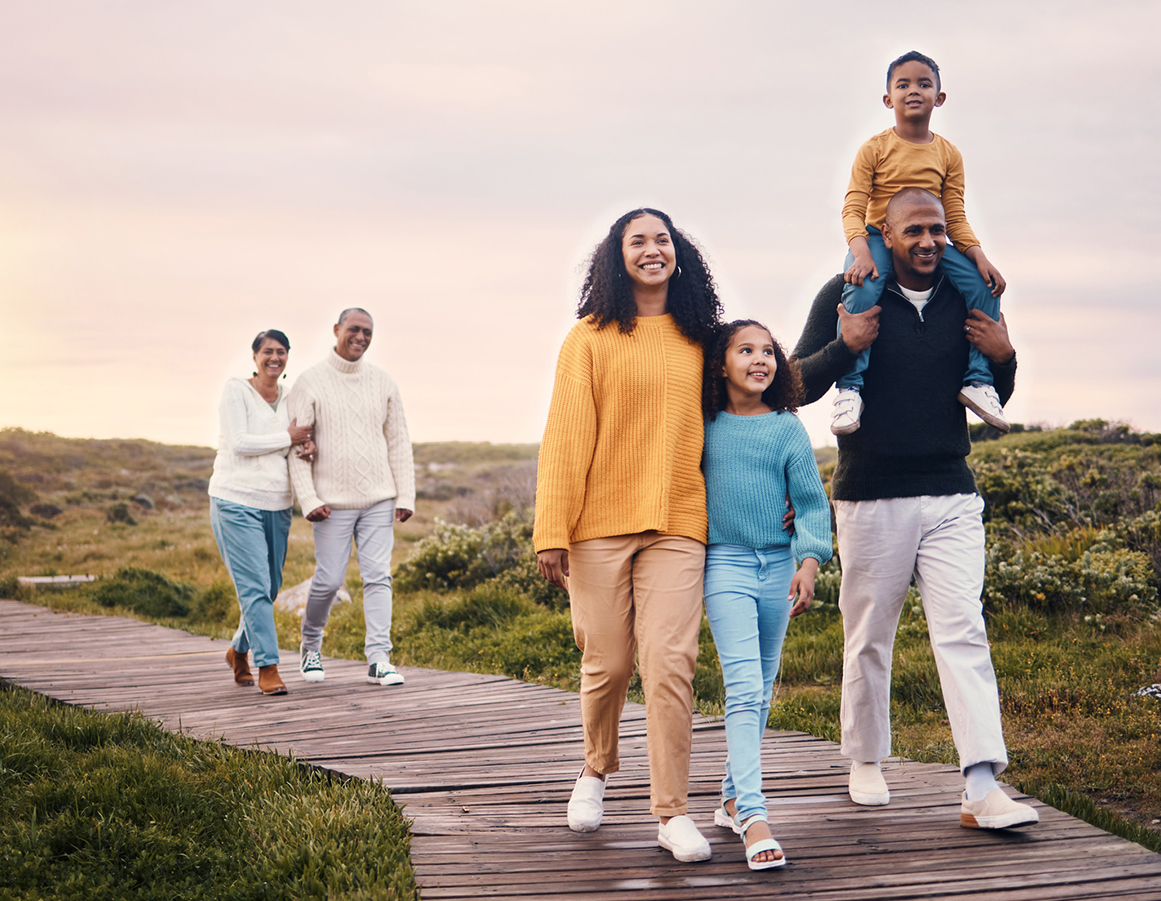 Multi-generational family walking together outdoors