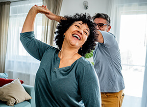 Couple Dancing in Living Room, Joyful