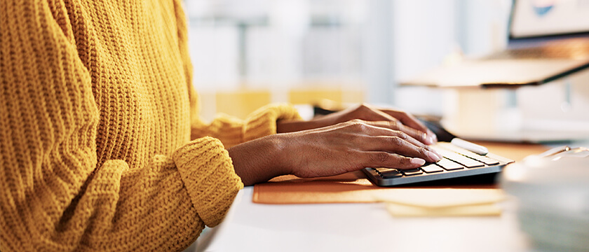 Woman Typing on Keyboard