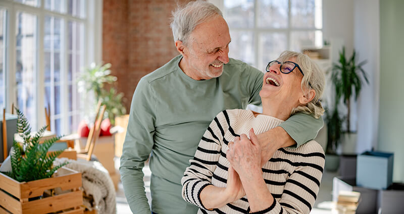 Older Couple Laughing Intimately