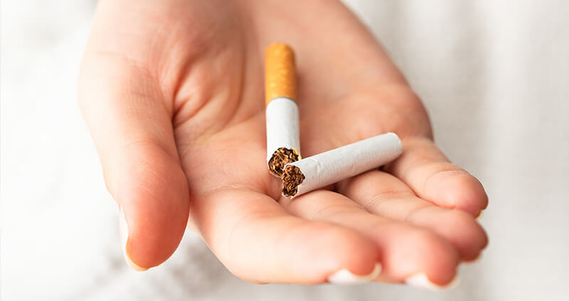 Broken Cigarette in Hand